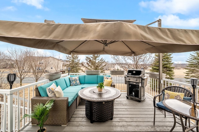 deck with grilling area and an outdoor living space