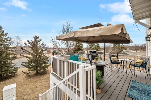 wooden deck with grilling area