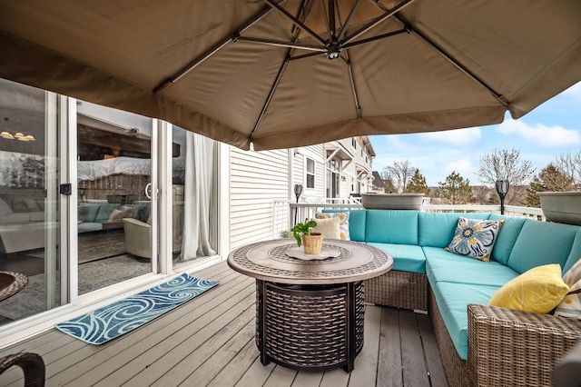 wooden terrace featuring outdoor lounge area