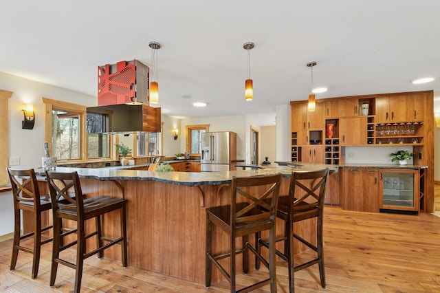 kitchen featuring brown cabinets, open shelves, light wood-style floors, beverage cooler, and stainless steel fridge with ice dispenser