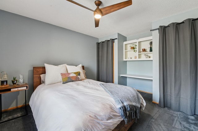 carpeted bedroom with ceiling fan, a textured ceiling, and baseboards