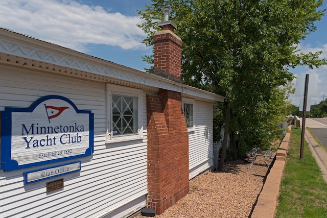 view of side of property featuring a chimney