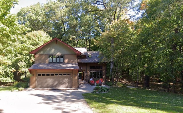 view of front of house with an attached garage and aphalt driveway