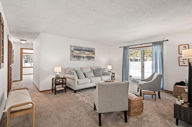 carpeted living room with a wealth of natural light and a textured ceiling