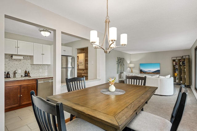 dining space with an inviting chandelier