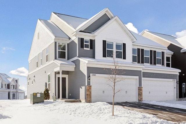 view of front of home with an attached garage and stone siding