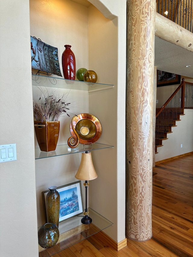 interior details with baseboards and wood finished floors