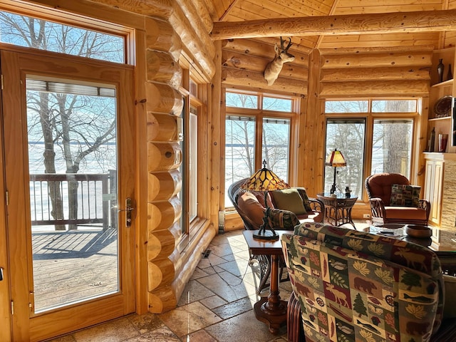 sunroom / solarium featuring wooden ceiling