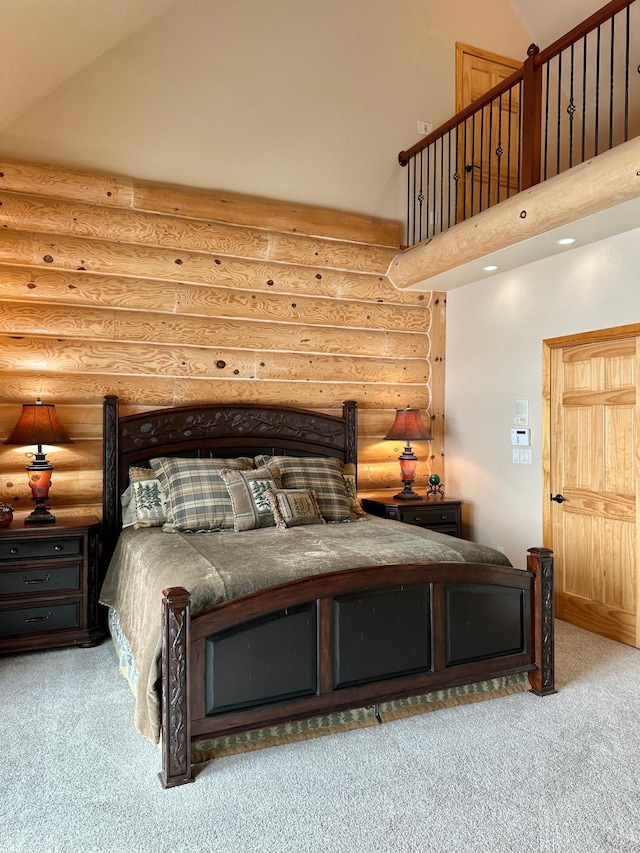 carpeted bedroom with high vaulted ceiling