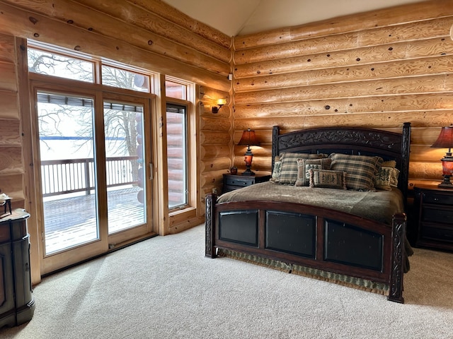 bedroom with access to exterior, light carpet, lofted ceiling, and log walls