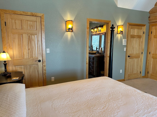 bedroom with baseboards and carpet floors