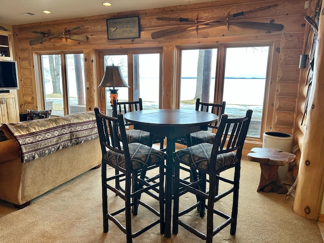 dining space with recessed lighting and light carpet