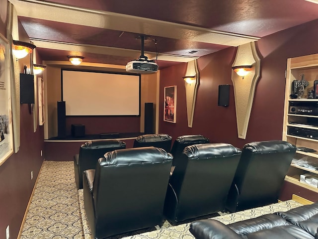 home theater room featuring a textured ceiling