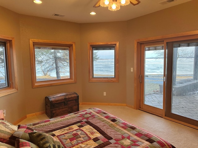 carpeted bedroom featuring access to exterior, recessed lighting, baseboards, and visible vents