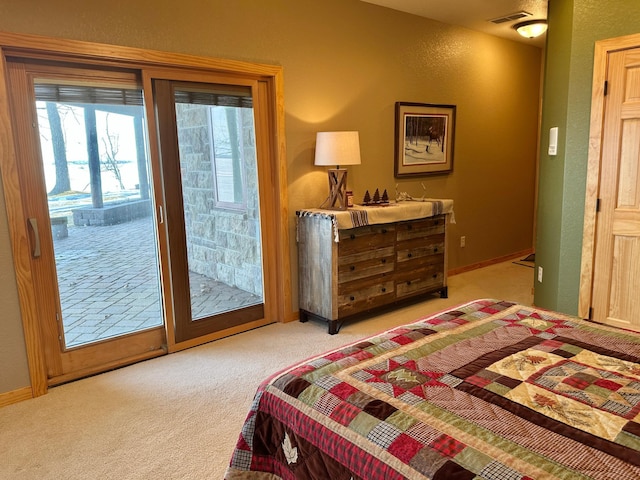 bedroom with baseboards, visible vents, light carpet, access to outside, and a textured wall