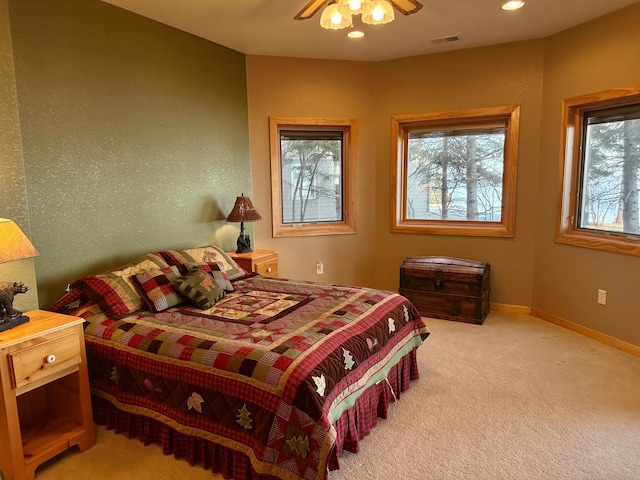 carpeted bedroom with visible vents, recessed lighting, a ceiling fan, and baseboards