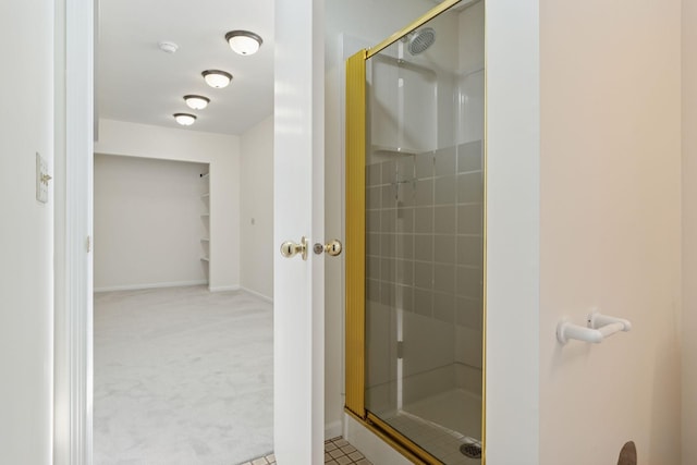 full bath featuring baseboards and a stall shower