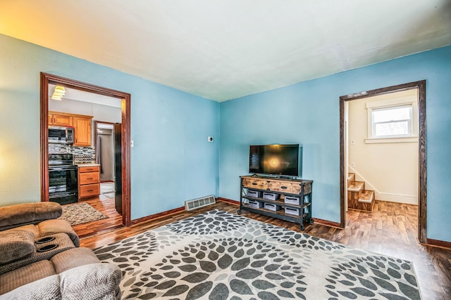 living room with wood-type flooring