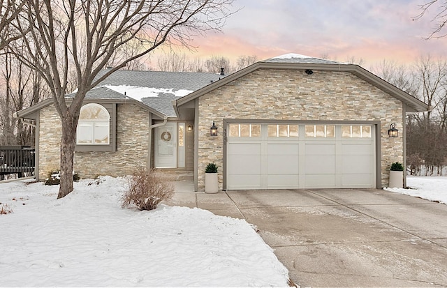 ranch-style home featuring a garage