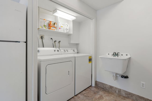 laundry room featuring sink and washing machine and dryer