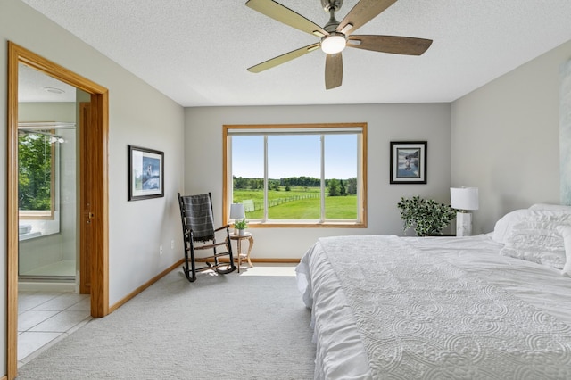 8051 165th St E, Credit River Twp, MN 55372 - carpeted bedroom with multiple windows, ensuite bath, a textured ceiling, and ceiling fan