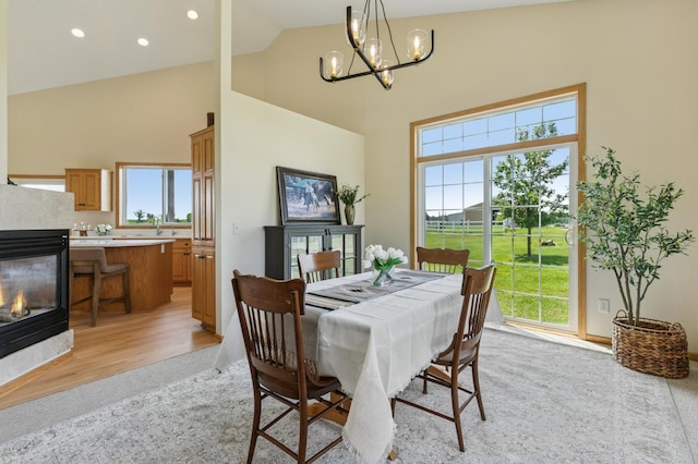 8051 165th St E, Credit River Twp, MN 55372 - dining space featuring a chandelier, high vaulted ceiling, plenty of natural light, recessed lighting, and light wood-style flooring