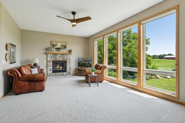 8051 165th St E, Credit River Twp, MN 55372 - living area featuring a ceiling fan, carpet floors, and a fireplace