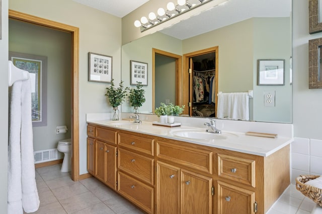 8051 165th St E, Credit River Twp, MN 55372 - bathroom featuring double vanity and tile patterned flooring