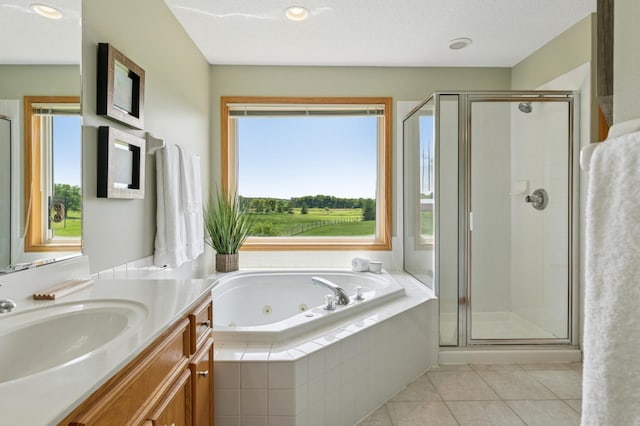 8051 165th St E, Credit River Twp, MN 55372 - bathroom with vanity, a jetted tub, a stall shower, and tile patterned floors
