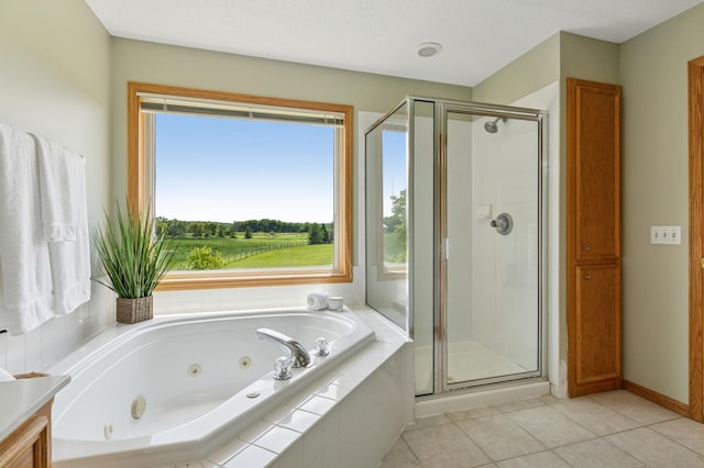 8051 165th St E, Credit River Twp, MN 55372 - full bathroom with a stall shower, a whirlpool tub, tile patterned flooring, and vanity