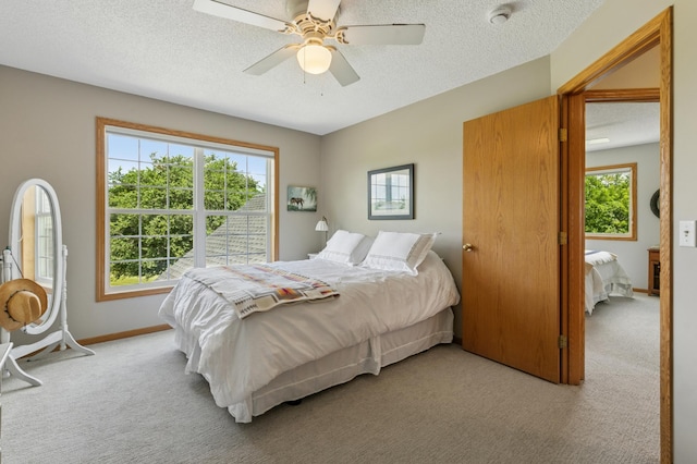 8051 165th St E, Credit River Twp, MN 55372 - bedroom with light carpet, a textured ceiling, and ceiling fan