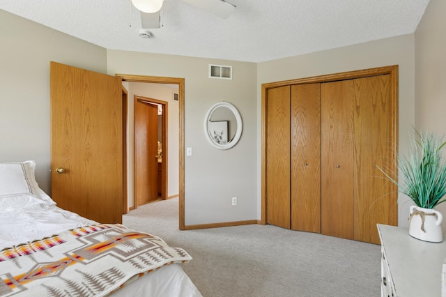 8051 165th St E, Credit River Twp, MN 55372 - carpeted bedroom with a closet, ceiling fan, and a textured ceiling
