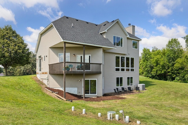 8051 165th St E, Credit River Twp, MN 55372 - back of house featuring a chimney, a shingled roof, a yard, and a patio