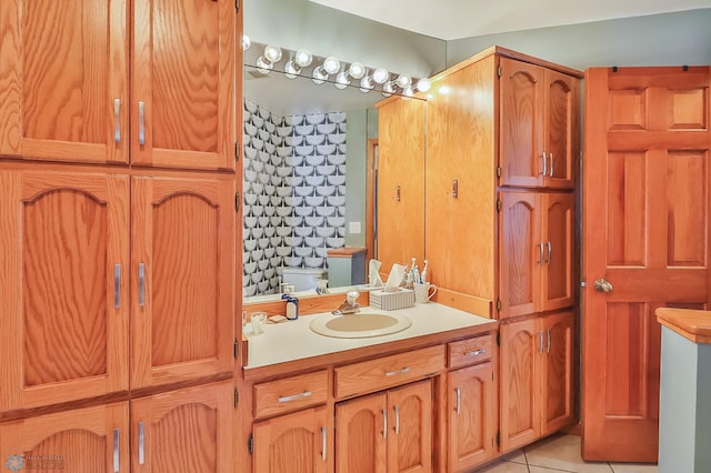 bathroom featuring tile patterned flooring and vanity