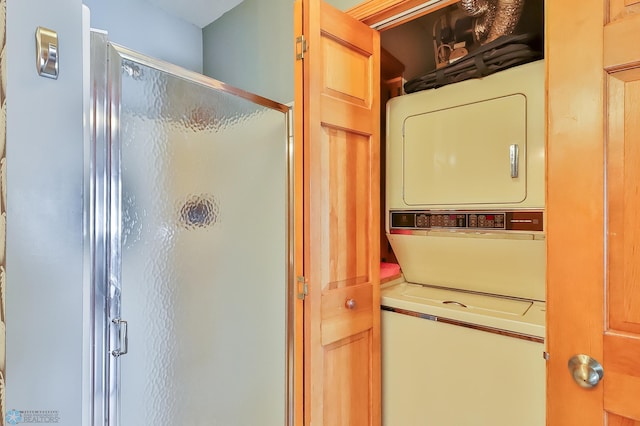 washroom with stacked washer and clothes dryer