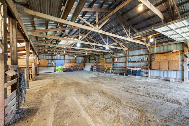 garage featuring metal wall and a garage door opener