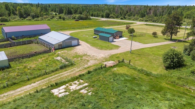 bird's eye view featuring a rural view and a forest view