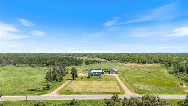 aerial view featuring a rural view and a forest view