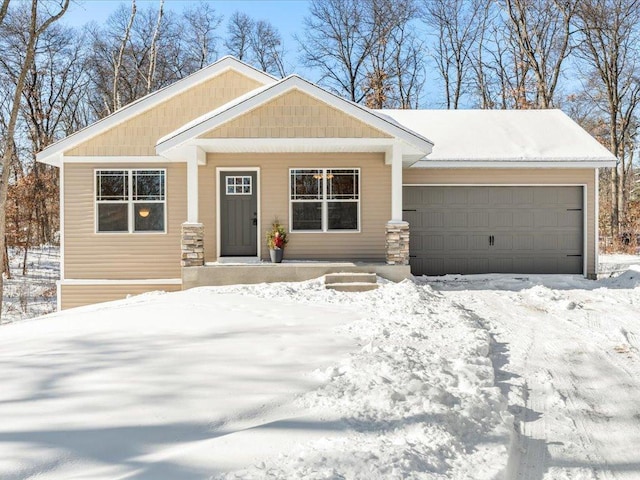 view of front of house featuring a garage and covered porch