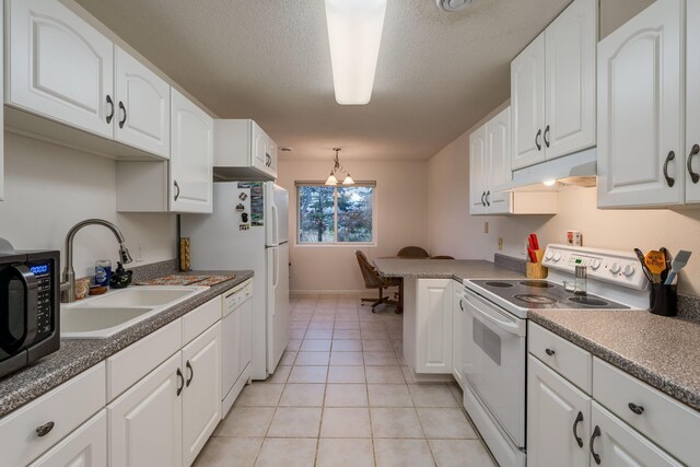 kitchen featuring white appliances, light tile patterned flooring, a sink, under cabinet range hood, and white cabinetry