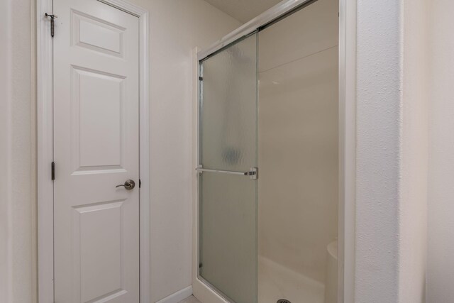 bathroom featuring a stall shower