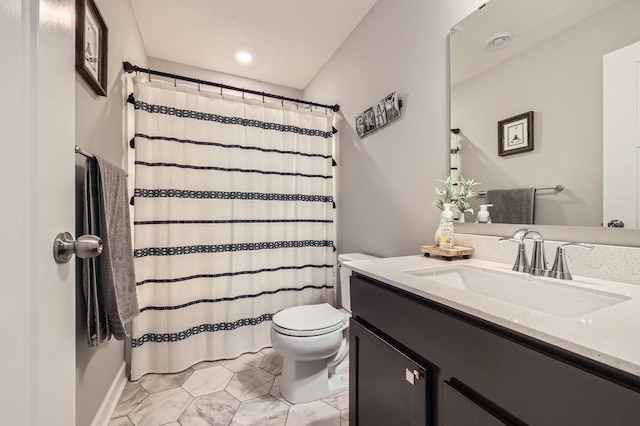 bathroom with vanity and toilet