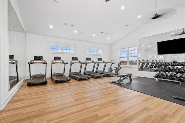 gym featuring high vaulted ceiling, recessed lighting, baseboards, and light wood finished floors