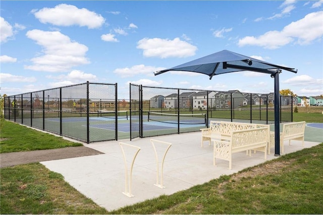 exterior space featuring a residential view, fence, and a yard