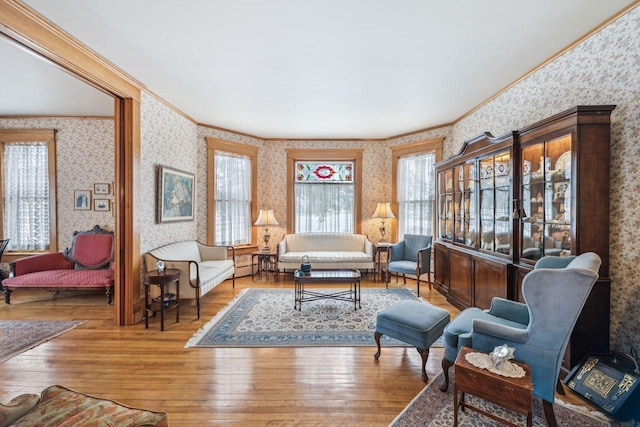 living room with crown molding and wood-type flooring