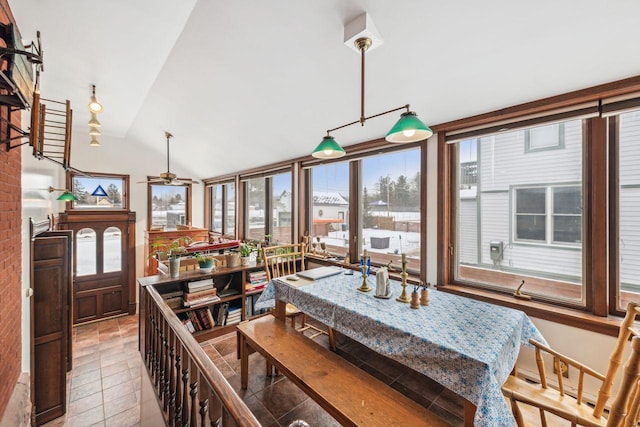 dining room featuring lofted ceiling