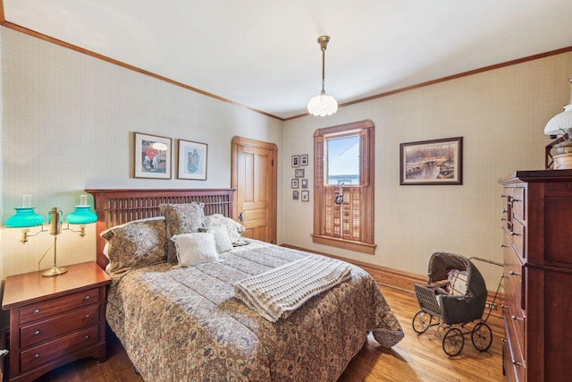 bedroom featuring wood-type flooring and crown molding