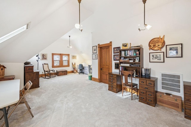 carpeted home office with high vaulted ceiling