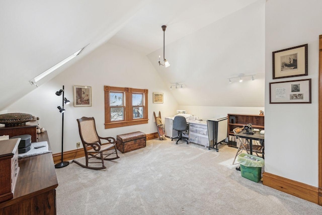 office area with light colored carpet and lofted ceiling with skylight