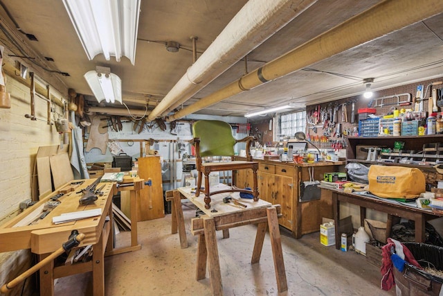misc room with a workshop area